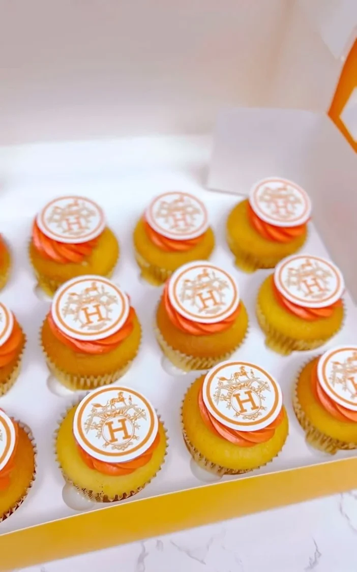 Orange and yellow branded cupcakes