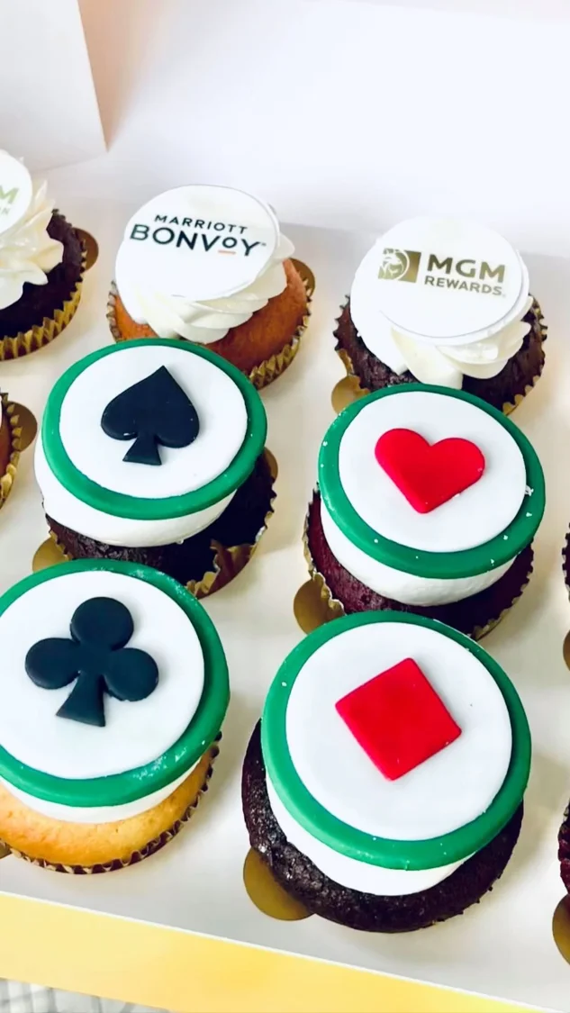 Cupcakes with green and red logo decorations