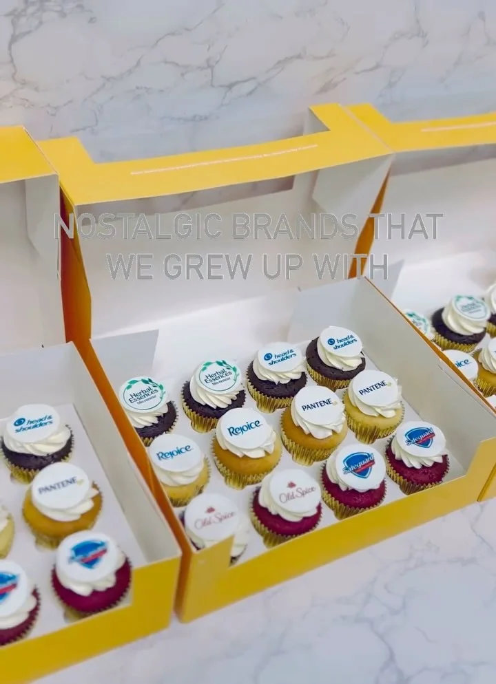 Packaged corporate cupcakes with printed logos