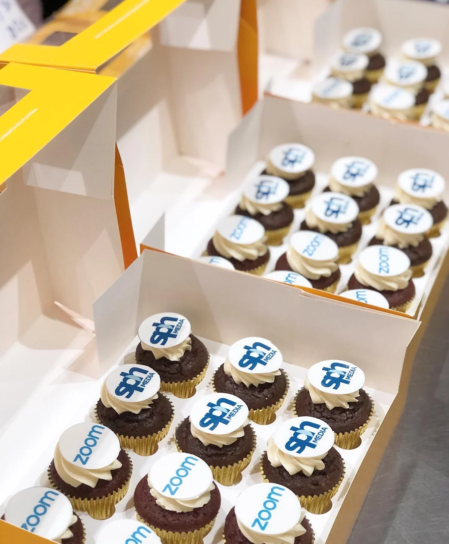 Packaged cupcakes in yellow gift boxes