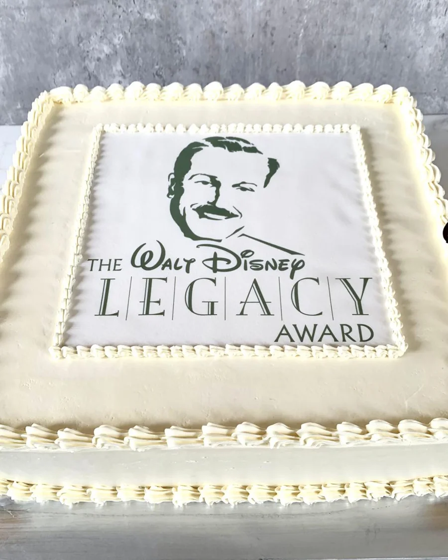 White rectangular cake with an awards logo