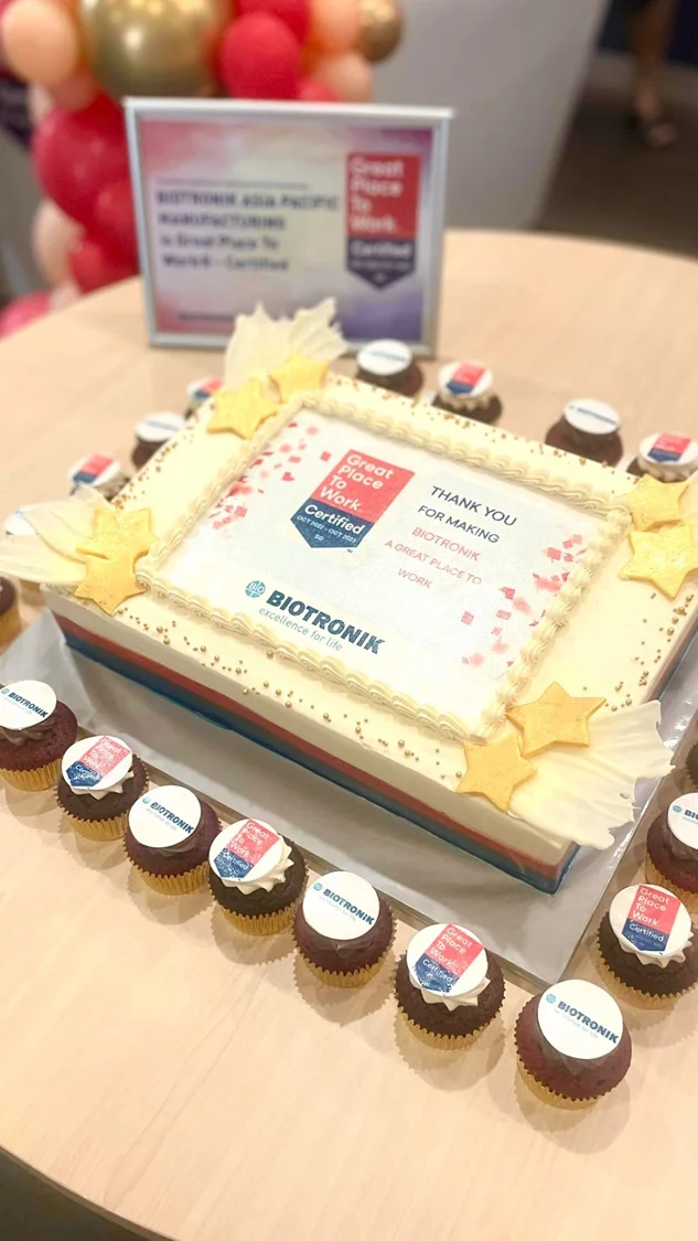 Rectangular branded cake with matching cupcakes