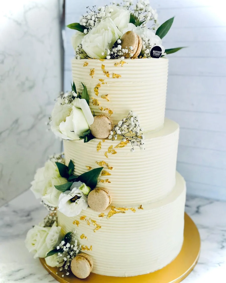 Three-tier white floral wedding cake