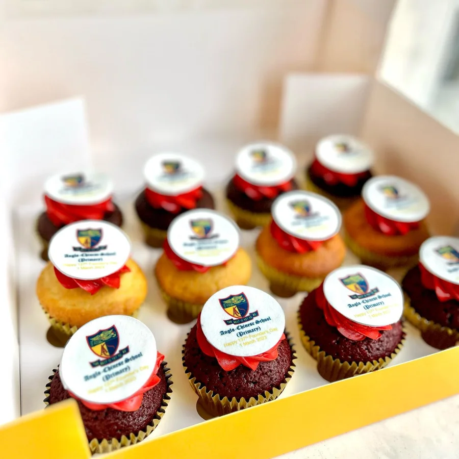 Corporate cupcakes with red and white logo decorations