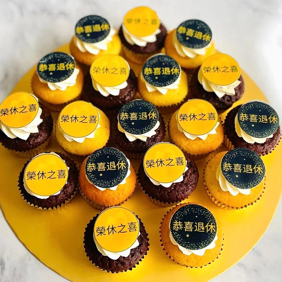 Black and yellow branded cupcakes