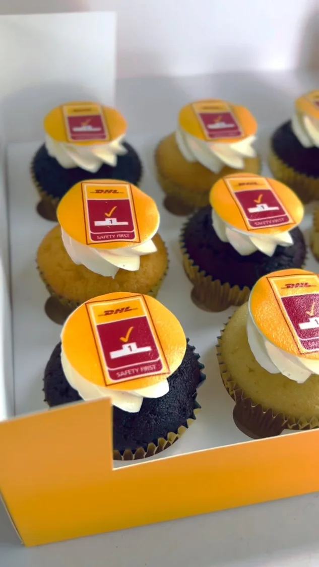 Corporate cupcakes with yellow logo decorations