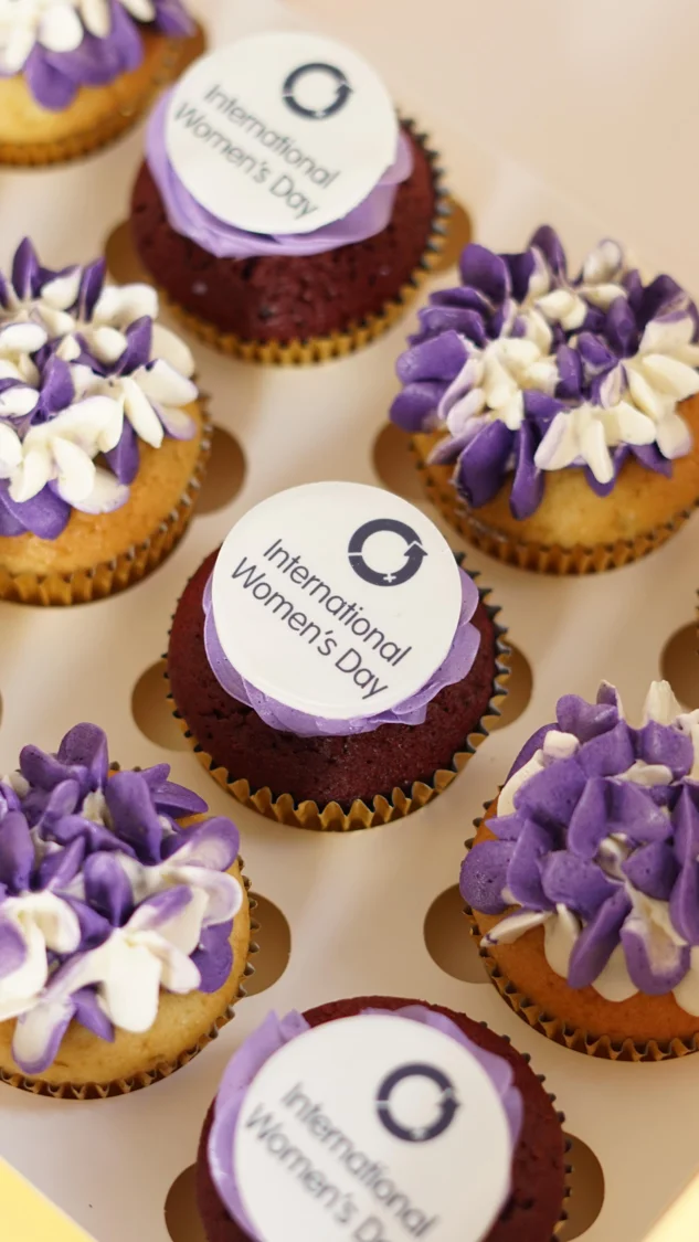 Purple frosted cupcakes with printed logos