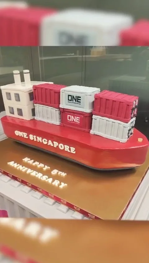 Celebration cake shaped like a red ship