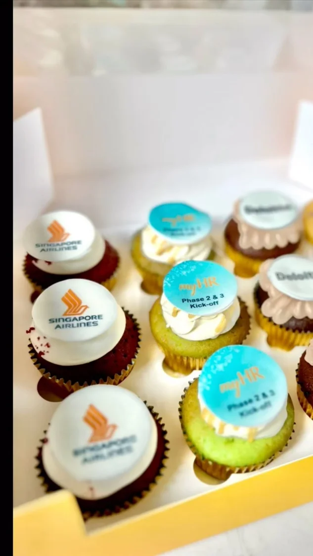 Branded cupcakes displayed for corporate gifting