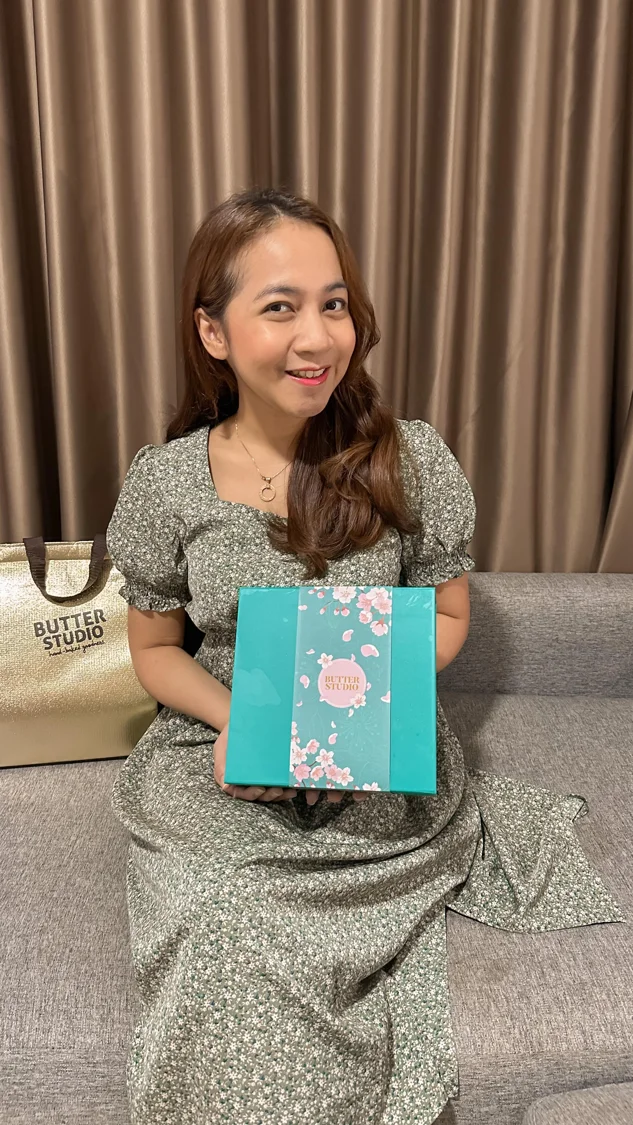 Butter Studio gift box held by a recipient