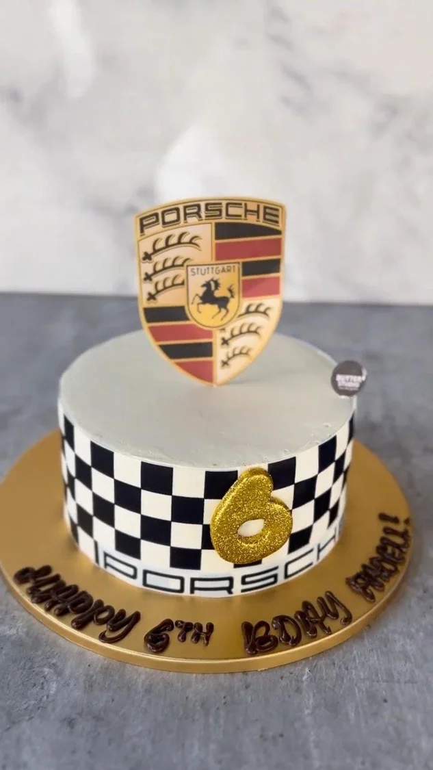 Celebration cake with a black and white checked decoration