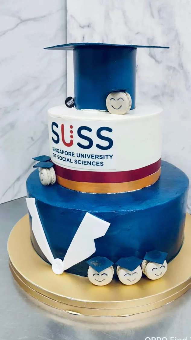 Blue and white graduation cake